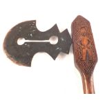 A West African tribal axe with pierced blade and figure carving