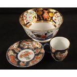 An 19th Century Worcester floral cup and saucer (rim chips) and a Spode floral slop bowl, Patt No.