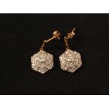 A pair of 9ct Gold hexagonal Diamond cluster earrings