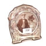 An Art Nouveau Silver photo frame with embossed bird and floral decoration,