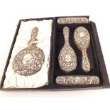 A cased Silver dressing table set (as found),