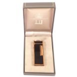 A cased Dunhill gilt and black enamel lighter in original box