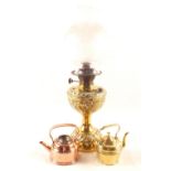 A Brass oil lamp plus two miniature Brass and Copper kettles