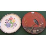 A Wedgwood terracotta plate painted with a kingfisher and a Poole floral plate