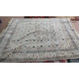 A machine made Persian style floral carpet,