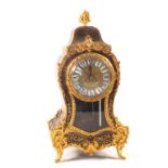 A French Boulle mantel clock in waisted case, enamel dial,