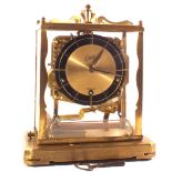 A German Schatz Brass four glass clock