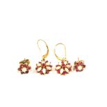 Two pairs of earrings both flower form,