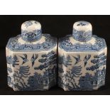 A pair of 19th Century Willow pattern tea caddies