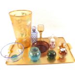 Various coloured glass including a blue overlaid bottle and paperweights