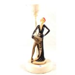 A composition lady figurine in Art Deco style