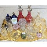 A pair of red flashed decanters plus other glassware