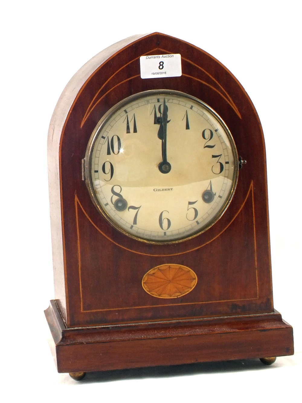 An Edwardian inlaid Mahogany striking mantel clock with Gilbert movement