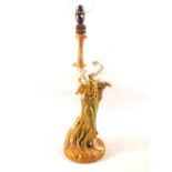 A Royal Worcester blush ivory table lamp in the form of a lady standing by a tree, Patt No.