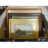 A box of various paintings and prints