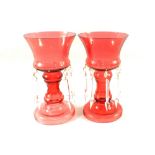 A pair of cranberry glass table lustres