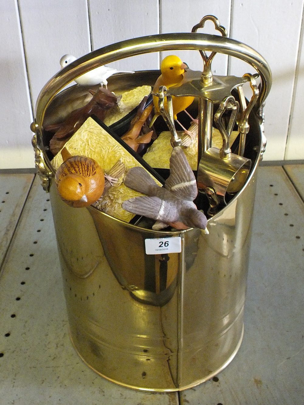 A Brass log bucket and contents