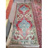 A yellow ground wool rug and a Persian rug (as found)