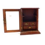 An Edwardian Oak smokers cabinet