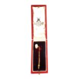 An 18ct Gold Pearl set stick pin