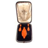 An impressive suite of carved Coral Gold mounted jewellery consisting of a large oval brooch with