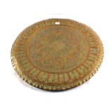 A 19th Century Middle Eastern circular Brass table top with central sunburst design