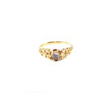 A Gold Diamond ring with pierced shoulders in the form on interlocking circles,