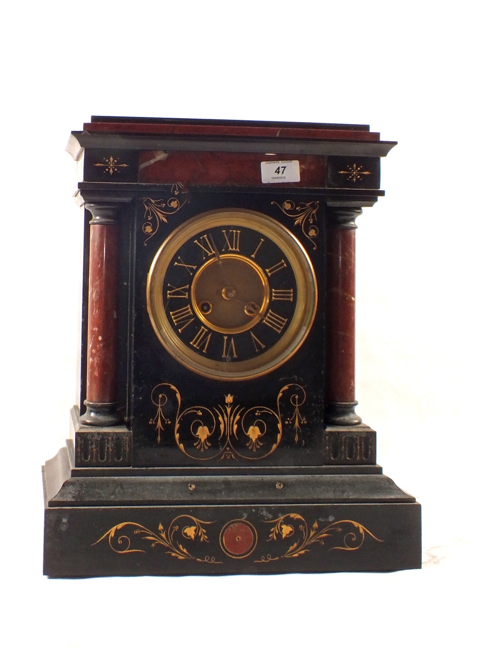 A substantial Victorian black and rouge marble mantel clock