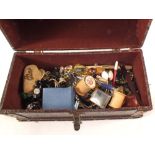 A dome top case containing costume jewellery