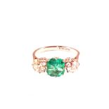 A Platinum three stone ring set with Emerald, with two Diamonds either side, est Diamond weight 1.