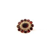 A Garnet and Seed Pearl set Gold brooch