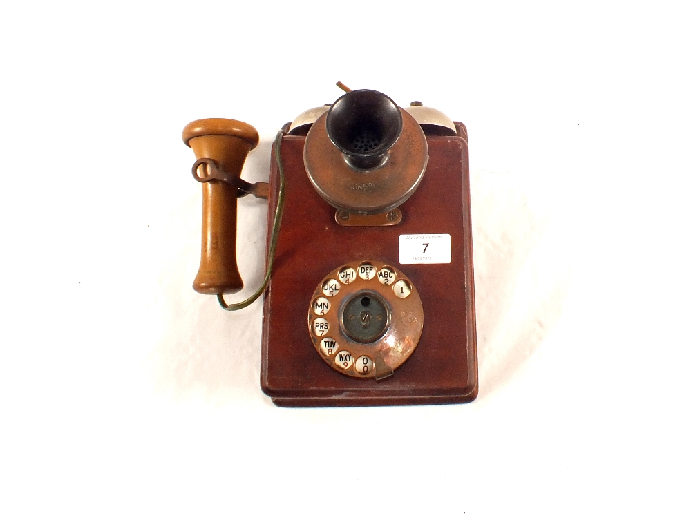 A Mahogany wall telephone,