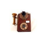 A Mahogany wall telephone,