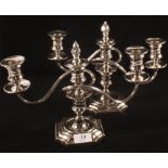 A pair of plated two branch candelabra