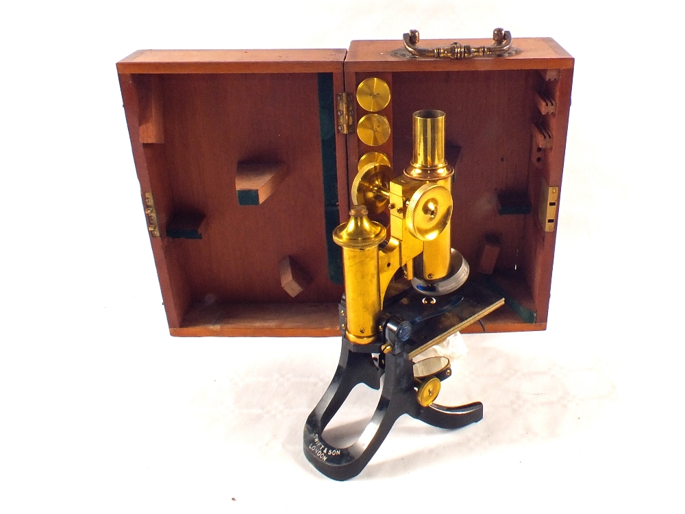 A Mahogany cased Swift & Sons Brass microscope