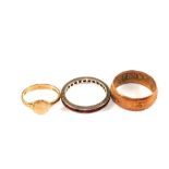 A group of three rings consisting of a small 9ct Gold signet ring,