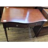 A reproduction Mahogany Serpentine front two drawer side table and open bookcase