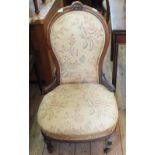 A Mahogany turned back nursing chair with floral upholstery