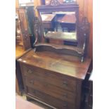 An Edwardian Oak dressing chest with three drawers