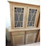 A 19th Century Pine sideboard with two frosted astral glazed doors over a two door cupboard