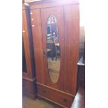 An Edwardian Satinwood oval mirror