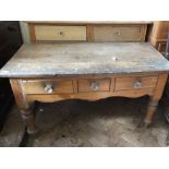 A Victorian Pine rectangular three drawer table on turned legs with glass handles