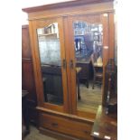 An Edwardian Satinwood two mirror door wardrobe