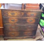 An Oak chest of two short and three long drawers