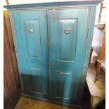 A 19th Century continental teal painted Pine two door kitchen cupboard with air vents