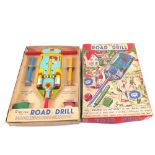 A boxed Peter Pan series tin plate road drill