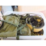 A quantity of military camo uniforms with '58' webbing etc and a modern military issue Kevlar