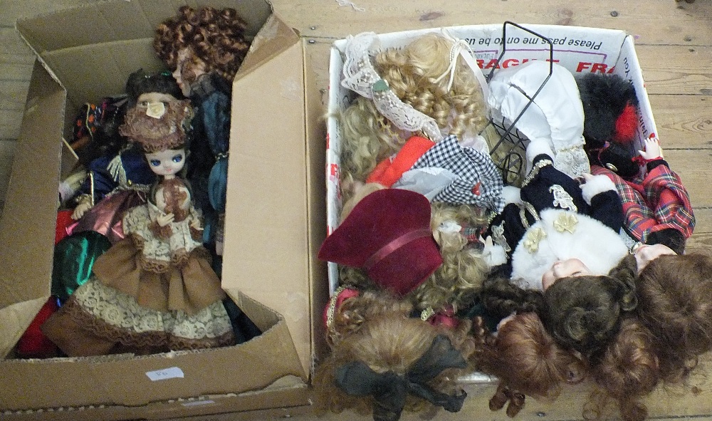 Two boxes of various dolls