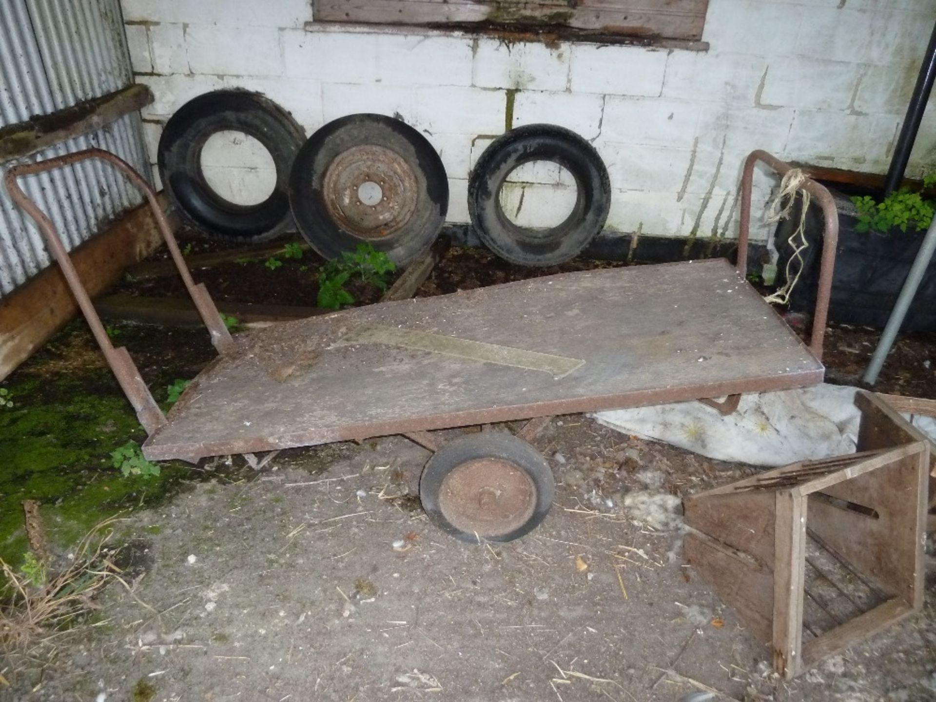 One flat two wheel barrow and one three wheel feed barrow. Stored near Beccles.