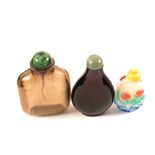 Three Chinese glass snuff bottles, one Amethyst with Jade stopper,